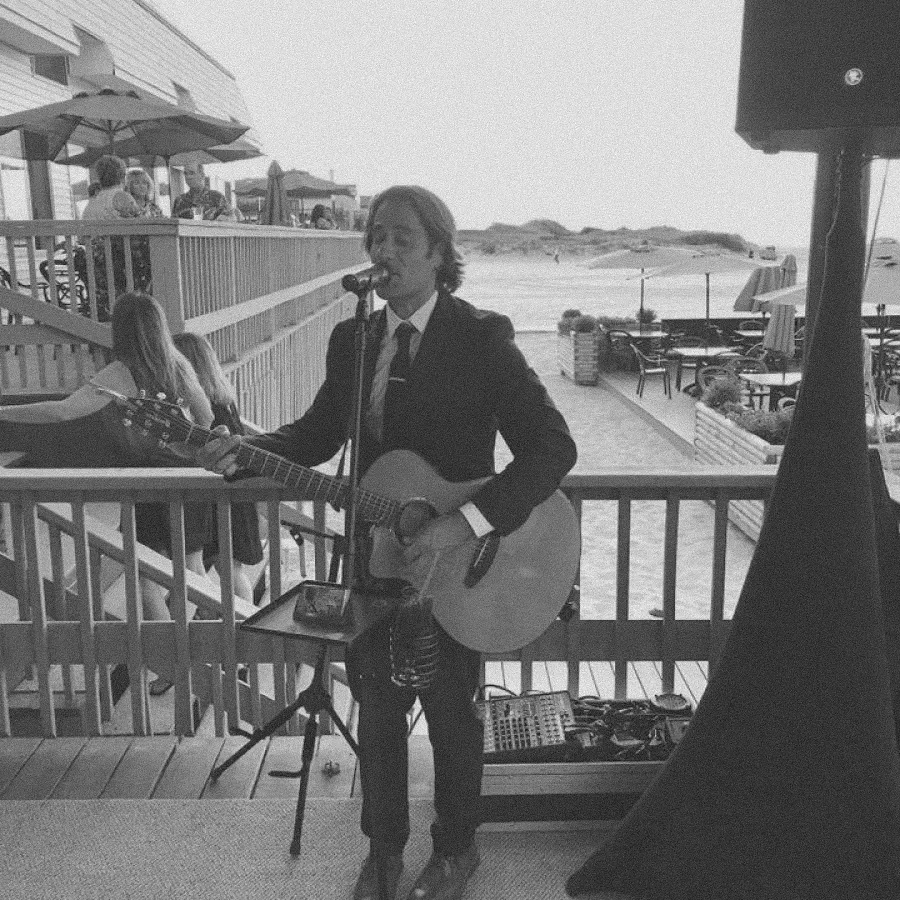 Live musician performing during cocktail hour.